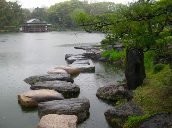 Stepping stones with Ryotei across the pond