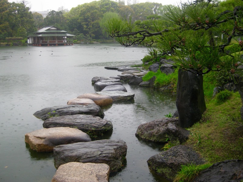 Stepping stones with Ryotei across the pond