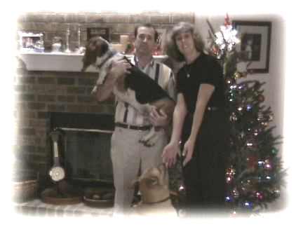 The family in front of the tree.