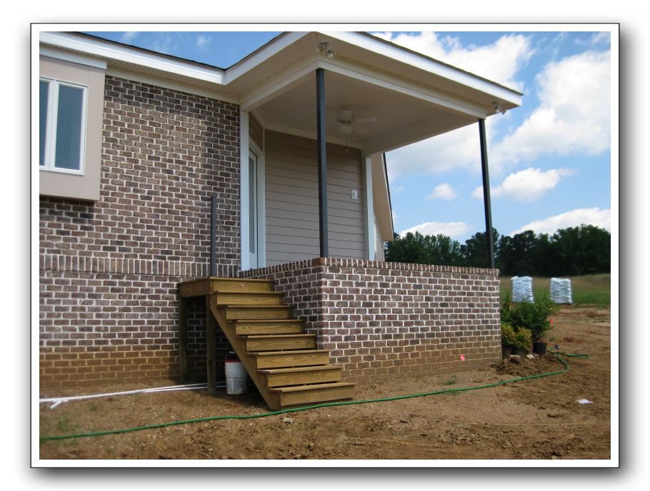 Screen porch has steps