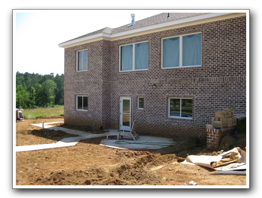 Back of house with new concrete