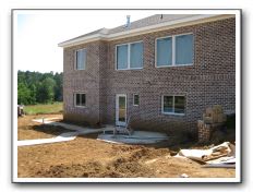 Back of house with new concrete